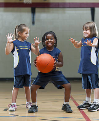 Kids playing basketball.