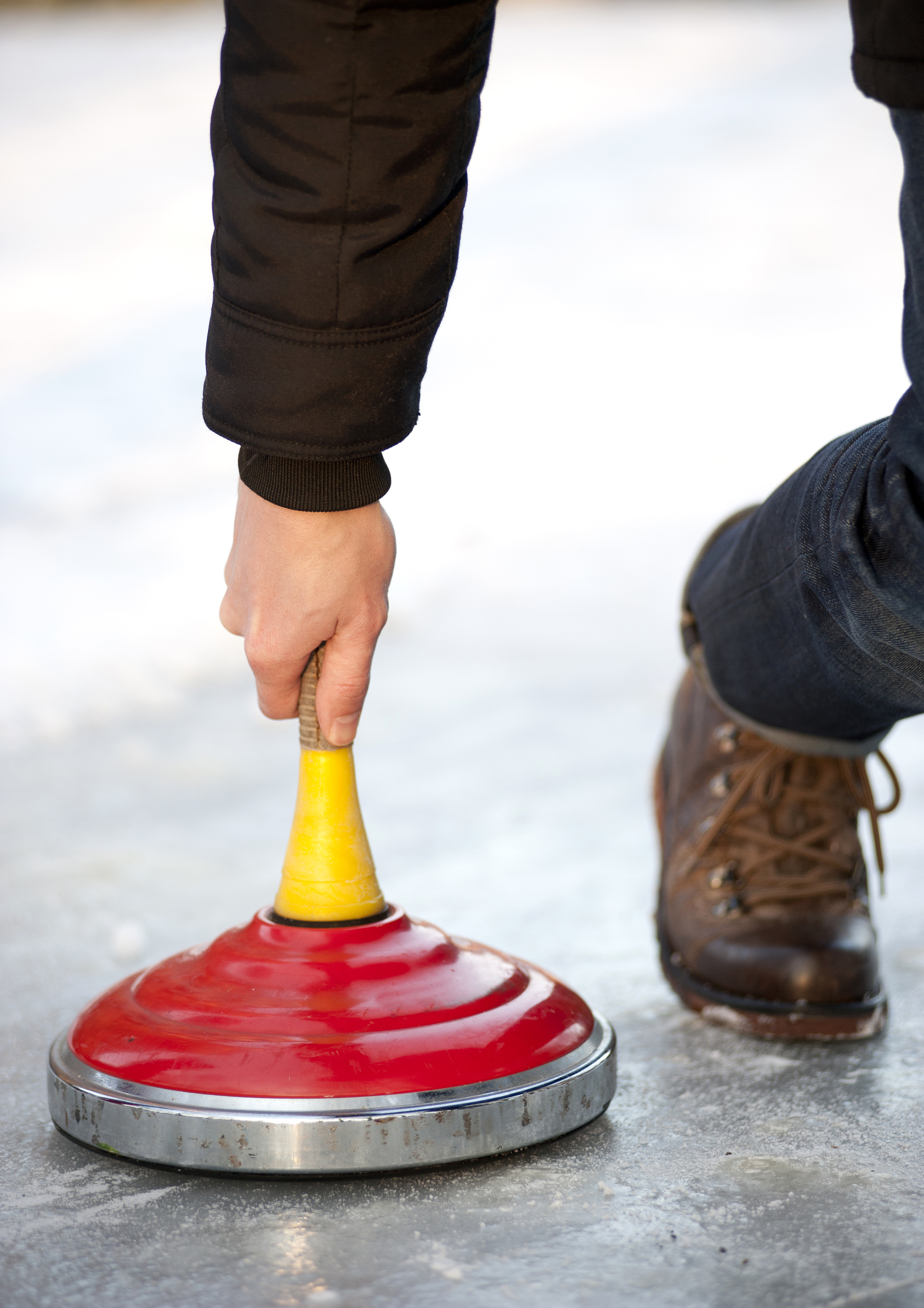 curling on ice outside