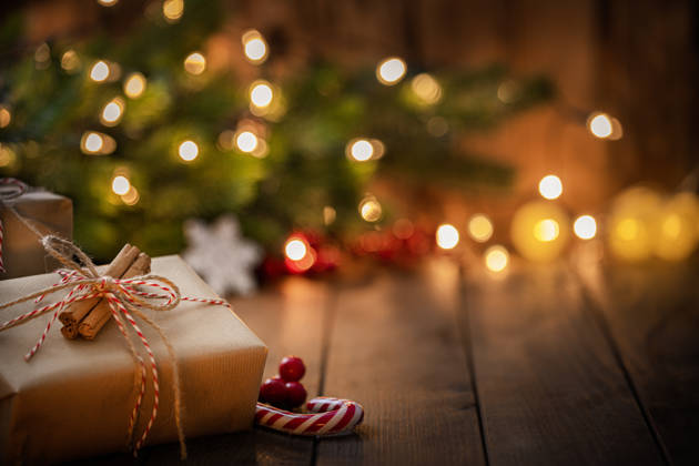 Brown Christmas gift box on rustic wooden table. High resolution 42Mp studio digital capture taken with Sony A7rII and Canon EF 70-200mm f/2.8L IS II USM Telephoto Zoom Lens