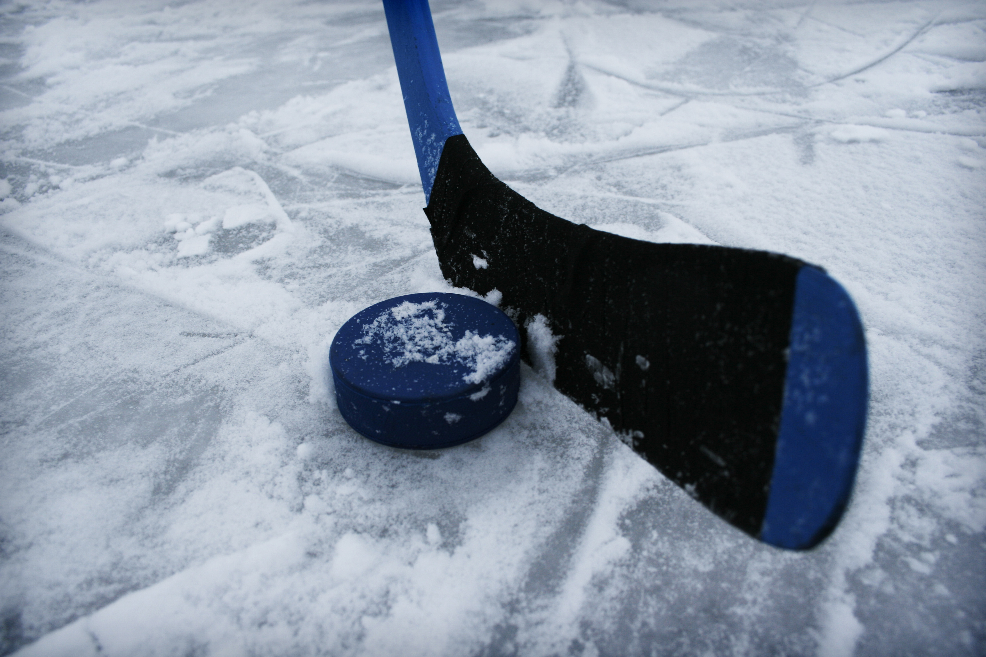Icehockey stick and a puck.